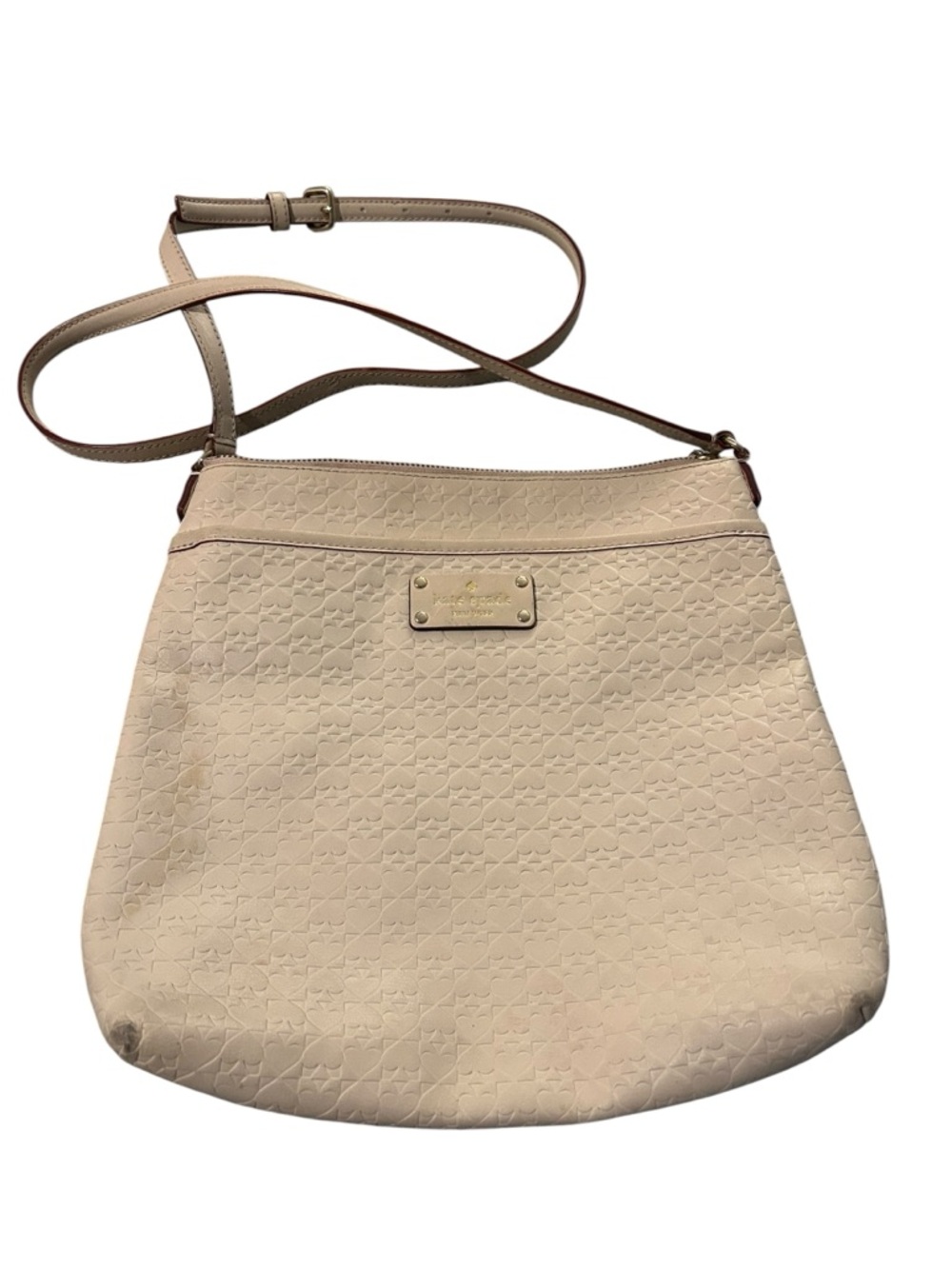 kate spade cream crossbody with embossed motif and gold plate